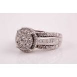 A 14ct white gold and diamond cluster ring, the round floral cluster set with round brilliant-cut