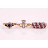 A three row half hoop ruby and diamond ring, the slightly curved band of circular cut rubies and