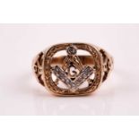 A 9ct gold and diamond Masonic ring, the large openwork cushion-shaped central plaque with a pair of
