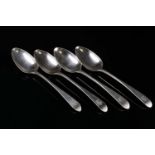 A set of four Victorian Scottish silver serving spoons, each engraved with a crest, Glasgow 1843, by