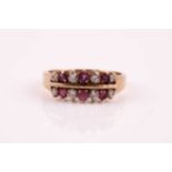 A ruby and diamond two row, half hoop ring, the round brilliant cut diamonds and circular cut