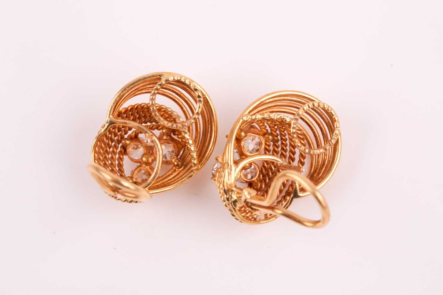 A pair of 18ct yellow gold and diamond earrings, each with a swirled rope-twist mount set with three - Image 4 of 6