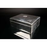 An early George V silver cigar box, Stuart Clifford & Co, London 1913, engraved with a crest with