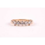 A 9ct yellow gold and diamond ring, set with five round brilliant-cut diamonds of approximately 0.50