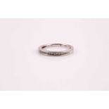 A half hoop diamond eternity ring, the princess cut diamonds in channel setting to white metal