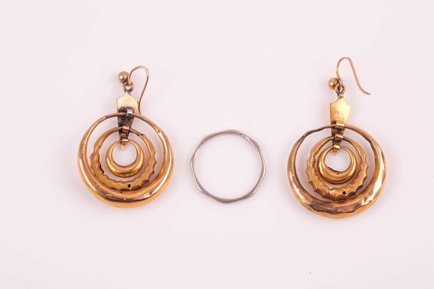 A pair of Victorian yellow metal triple hoop earrings, with three articulated hoops suspended from a - Image 2 of 5