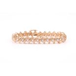 A 14ct yellow gold and diamond bracelet, set with twenty-five round brilliant-cut diamonds of