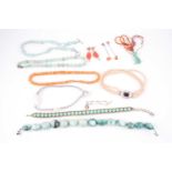 A group of various jewellery items, including a fluorite necklace, a green agate necklace, faux