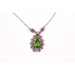 An early 20th century paste necklace; the central pear-shaped green glass pendant within a