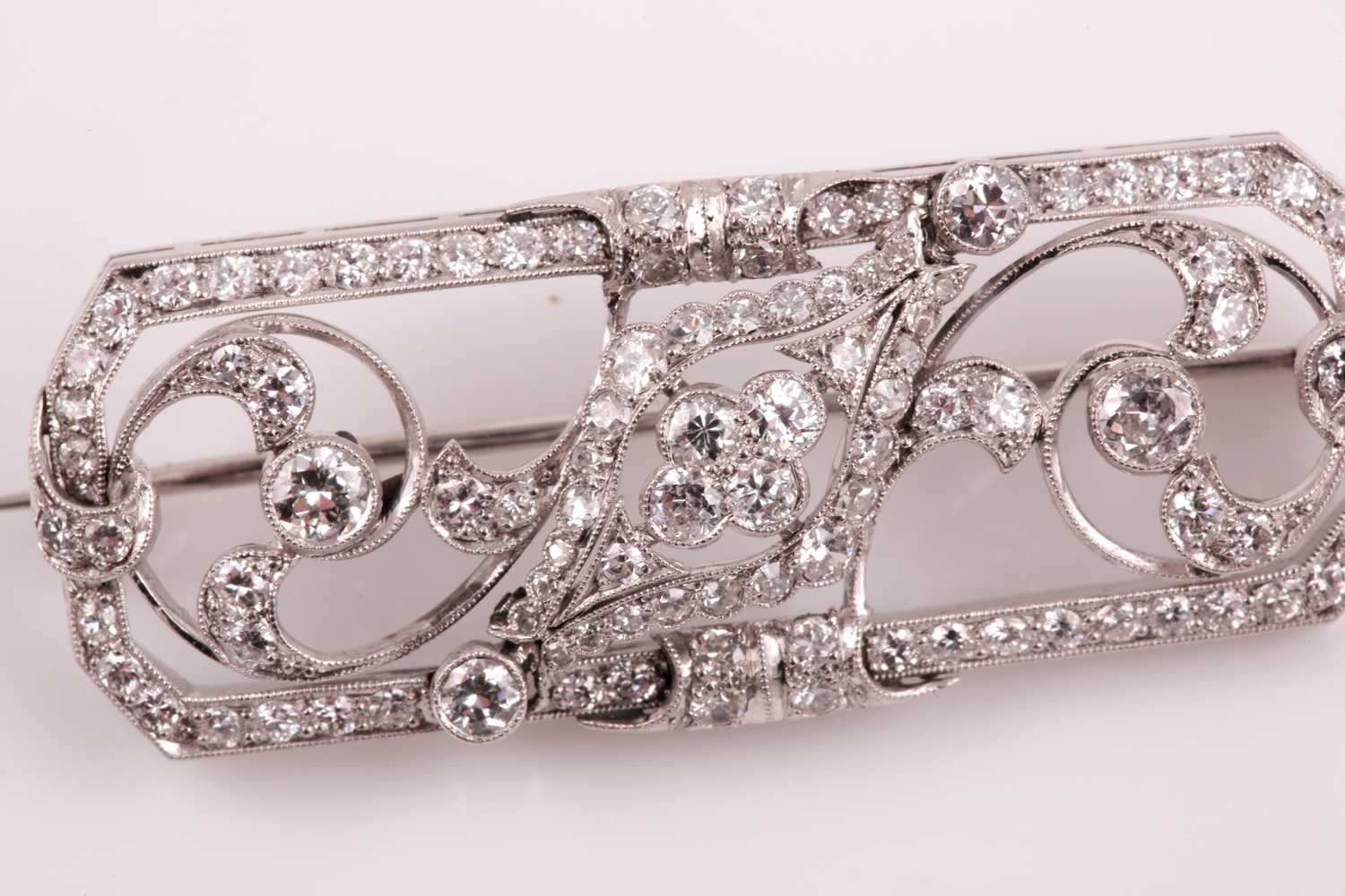 A platinum and diamond plaque brooch, of foliate design, inset with round-cut diamonds, total - Image 3 of 6