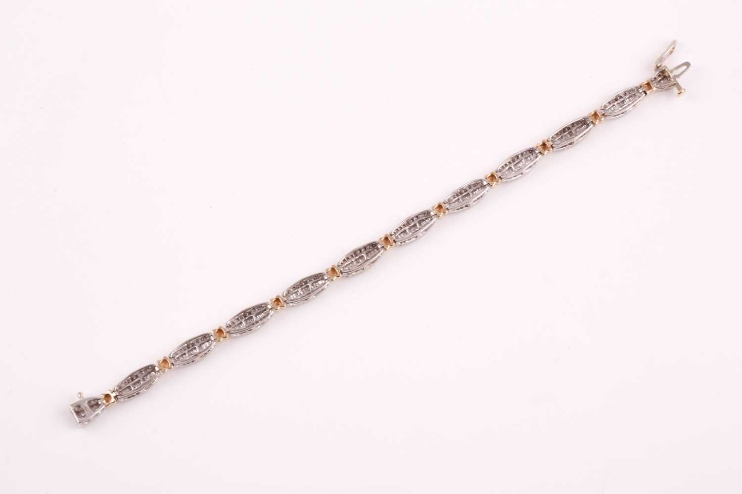 A diamond line bracelet, the tapered segments inset with mixed baguette-cut and round-cut - Image 7 of 7