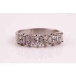 A diamond half hoop eternity ring, set with pairs of round brilliant cut diamonds between baguette