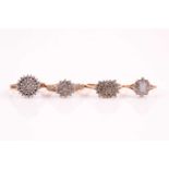 A diamond cluster ring, the flowerhead cluster set with round brilliant cut diamonds with an