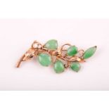 A 14ct yellow gold and jadeite brooch, of foliate design, stamped 14K.Condition report: 6.8g