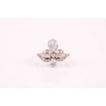 A late 19th / early 20th century diamond tiara ring, the quatrefoil design set with two pear-cut and