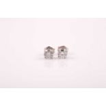 A pair of solitaire diamond earrings, the round brilliant-cut diamonds approximately 0.38 carats