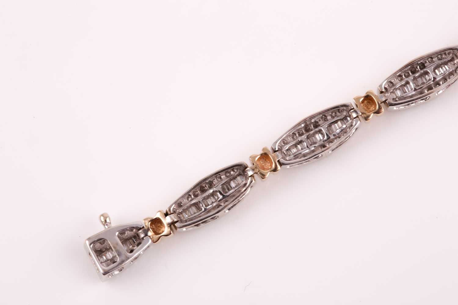 A diamond line bracelet, the tapered segments inset with mixed baguette-cut and round-cut - Image 4 of 7