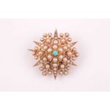 A late 19th / early 20th century yellow metal, pearl, and turquoise starburst brooch, set with round