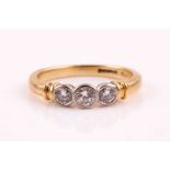 An 18ct yellow gold and diamond ring, set with three graduated round brilliant-cut diamonds of