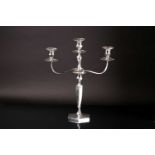 An early 20th century three branch candleabrum, the silver plated top section with three beaded