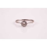 A single stone diamond ring; the old brilliant cut diamond in claw set illusion mount; to a plain