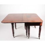 A George IV mahogany, geared concertina extending dining table in the manner of T & G Seddon, with