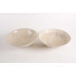 A pair of Cizhou bowls, possibly Northern Song, with knife cut foliate decoration against a