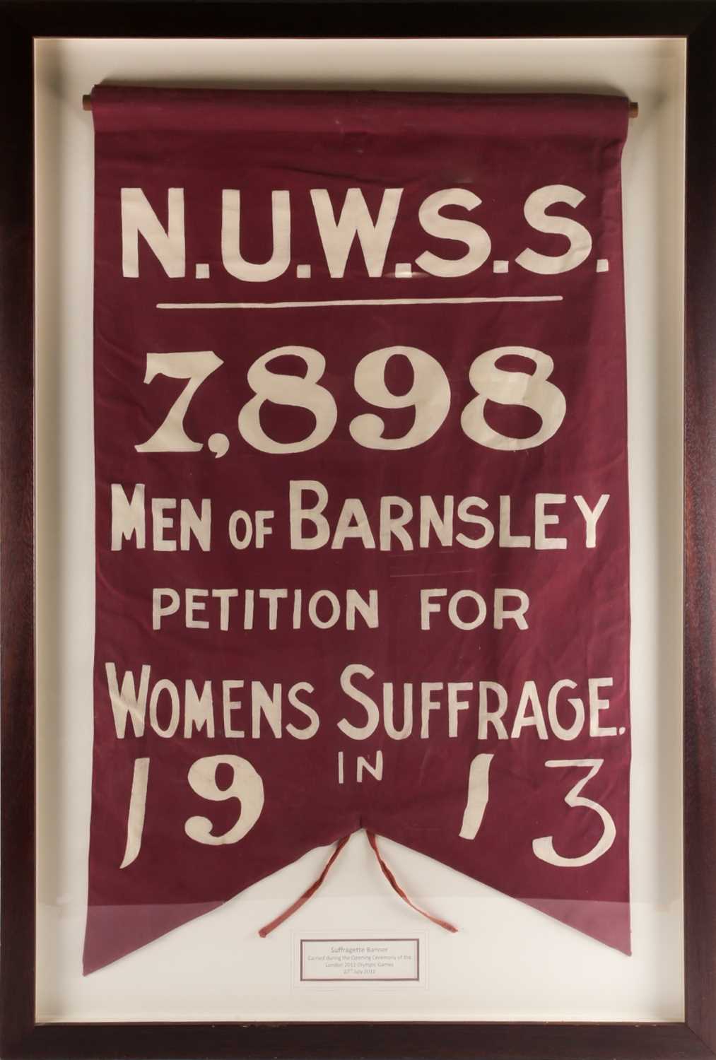 A framed, painted canvas Suffragette Banner, bearing the legend 'N.U.W.S.S. 7,898 Men of Barnsley