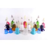 A collection of nineteen Victorian coloured glass bells, the largest 30 cm high.Qty: 19Condition