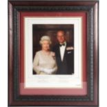 A framed photographic print of HM Queen Elizabeth II and HRH Prince Philip, Duke of Edindburgh