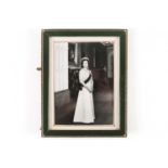 A framed presentation photograph of HM Queen Elizabeth II. The unsigned photograph (circa 1960/70)