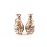 A pair of Chinese Canton enamel vases, second half 19th century, the shoulders with applied gilt