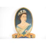 A large 20th-century naive oil on board portrait of Her Majesty Queen Elizabeth II wearing the