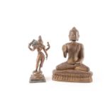 A Tibetan bronze figure a seated on a double lotus socle with hand in the Vitarka Mudra 15 cm wide x