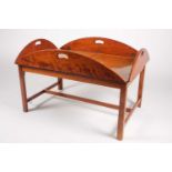A Victorian-style satin birch oval folding butlers tray and stand.Each leaf with a shaped hand hole.