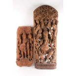 An Indian teak wood arched architectural panel, carved and pierced with Lord Ganesh and attendants