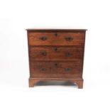 A 19th-century country-made chest of three long drawers, with clamped plank top, on shaped bracket