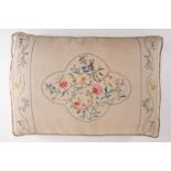 An early 20th-century cushion, hand-embroidered by HM Queen Mary in coloured silks with floral