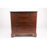 A George III style, mahogany commode chest of four long drawers. On shaped bracket feet. 76 cm