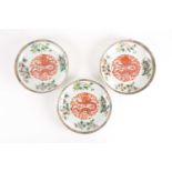 A set of three Chinese Famille rose porcelain circular, dragon dishes. Qing dynasty. Each painted