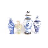 A collection of four Chinese porcelain vases and vases and covers. Late Qing dynasty and later.To