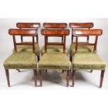 A set of six George IV mahogany dining chairs with broad cresting rails and reeded uprights, above