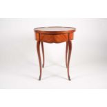 A Louis XV style, circular mahogany, and tulipwood veneered centre table. The tray top with