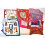 A Hermes Paris scarf, with key decoration, 86 cm square, together with a Jacqmar scarf and others.