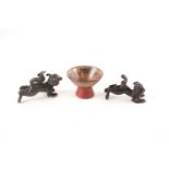 Two Chinese bronze shi shi, possibly late Ming, mid 17th century, each modelled ready to pounce, the