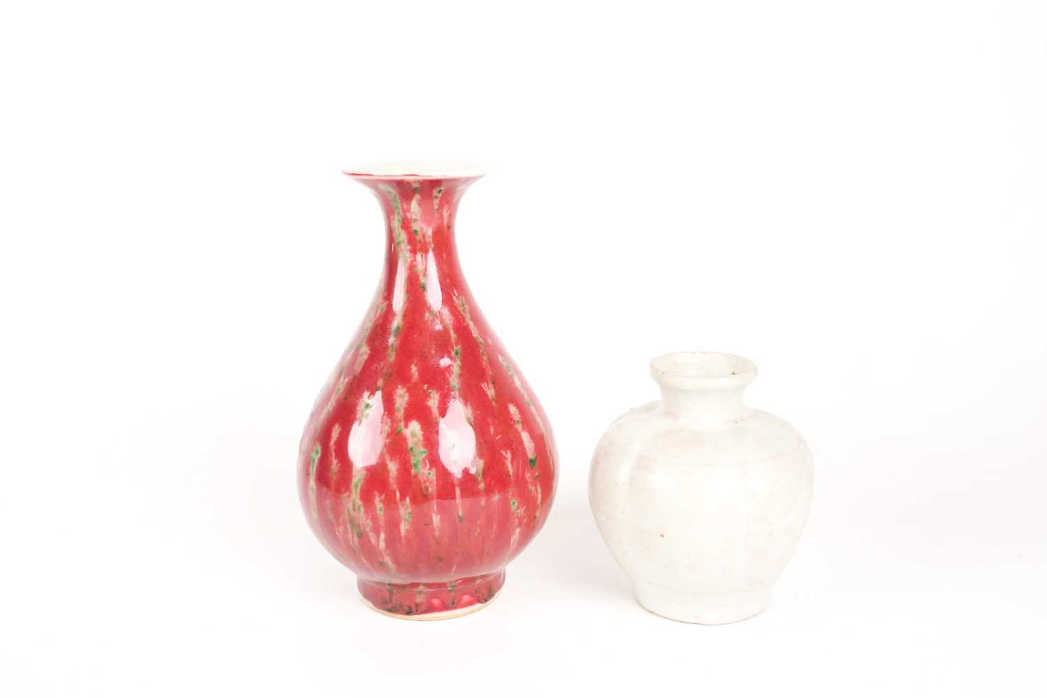 A Chinese white glazed segmented globular vase, Song dynasty, painted with underglaze red decoration