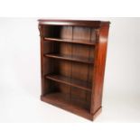 A Victorian figured walnut open bookcase with three adjustable shelves with dust baffle grooves.