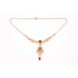 An Art Nouveau 15ct yellow gold and tourmaline lavalier necklace, bearing makers mark for Murrle