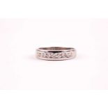 A 9ct white gold and diamond band ring, channel-set with round brilliant-cut diamonds of