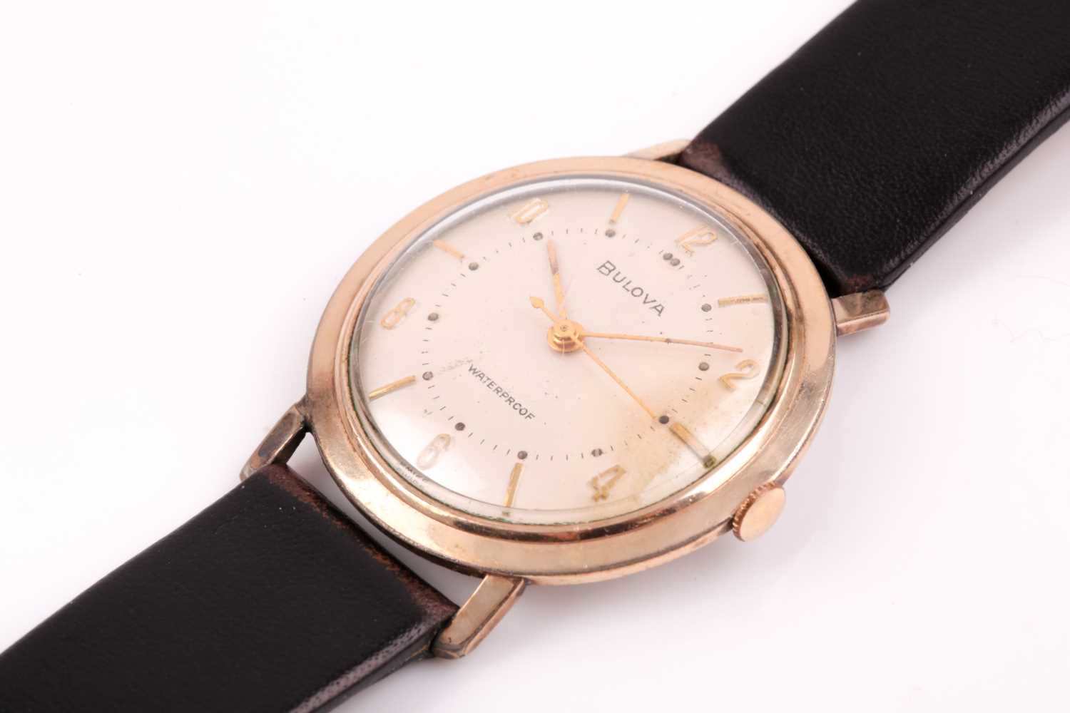 A Bulova mechanical wristwatch, the silvered dial with slim gilt numerals, in a gold cased case, - Image 12 of 12